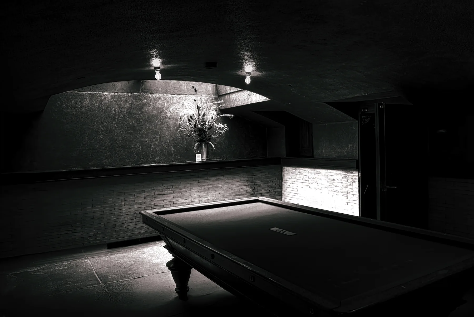 Pool table in a dim room